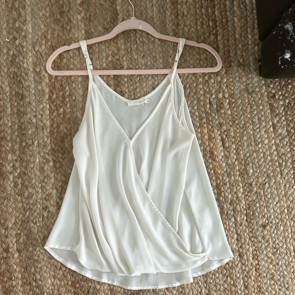 White flowy wrap-style tank